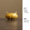Juego de té de cerámica amarillo limón con detalles dorados, que incluye una taza con tapa, tetera, taza de maestro, taza de degustación, taza de té, soporte para tetera, posavasos y taza de equidad