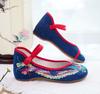 Sapatos de salto baixo bordados sapatos de pano com fundo curvado sapatos femininos estilo étnico lona Xiu Wo sapatos de casamento