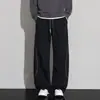 Calça esportiva casual de cor contrastante bordada para homens, calça de outono com silhueta dividida e curva, calça de moletom vintage solta texturizada