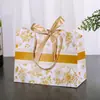 Sacolas de presente transfronteiriças com estampas florais e fitas, sacolas de embalagem de alta qualidade, sacolas de presente para feriados, bolsas de mão, sacolas de embalagem para roupas