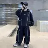 Conjunto Masculino Estilo Coreano Primavera e Outono 2026 Nova Blusa de Moletom com Capuz Calça de Perna Larga Conjunto de Duas Peças Solto Moda Roupa Esportiva Meio