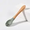 Colher Garfo de Silicone Transfronteiriça Louça Infantil Colher para Suplemento Alimentar de Treinamento para Bebê Colher para Alimentação de Bebê Garfo Colher com Cabo de Madeira para Criança Pequena