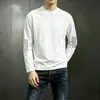 Camiseta casual versátil de manga larga para hombre para otoño, cuello redondo, color liso moderno, cómoda, transpirable y de corte holgado.