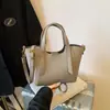 Bolsa de Mão de Luxo Versátil de Nicho Novo 2025 Feminina Textura Retrô Ombro Único Transversal Balde Bolsa para o Dia a Dia