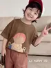 Camiseta de Manga Corta para Niños 2026 Verano Nuevo Estilo Ropa Exterior Camiseta Base para Bebé Top de Algodón para Niños Pantalones Cortos Venta al por Mayor Moderno