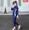 Traje de baño mediano y grande para niños y niñas, pantalones largos de manga larga, nuevo, protección solar, secado rápido, traje de buceo dividido, traje de baño