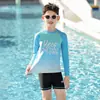 2026 Novo Modelo Roupa de Banho Infantil para Meninos, Conjunto de Duas Peças para Jovens, Shorts de Banho de Secagem Rápida de Camada Dupla Atacado