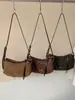 Bolso liso muy elegante 2026 nuevo bolso de axila francés de nicho para el día a día bolso de hombro cruzado casual a la moda para mujer