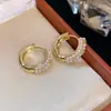 Modernos y Minimalistas Brazaletes para Oreja Retorcidos de Piedra Ojo de Tigre para Mujer, Pendientes Versátiles Vintage, Accesorios para Orejas de Otoño e Invierno con un Toque de Lujo Ligero y de Alta Gama