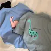2026 Nueva Camiseta Casual Suelta de Algodón Puro para Niños, Cuello Redondo, Manga Corta con Estampado de Dinosaurio, Top Elegante y Transpirable para Bebés