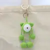 Pingente feito à mão em crochê de lã, pingente de crochê verde com um olho, chaveiro de tricô, joia para bolsa
