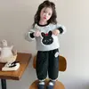 Traje de Primavera y Otoño para Niñas 2026 Nuevo Estilo Moda Dibujos Animados para Niños Sudadera con Capucha Pantalones de Pierna Ancha Ropa de Otoño Conjunto Casual de Dos Piezas para Bebé