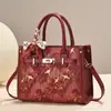 Bolsa de mano estampada de estilo chino transfronteriza, retro y ligera, un bolso de hombro o cruzado versátil de gran capacidad, perfecto para mujeres y madres