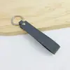 Llavero de PU de color sólido transfronterizo creativo de color caramelo banda ancha de cuero cuerda para la mano simple para llaves de coche de hombre venta al por mayor