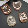 Kalimba de 8 tonos transfronteriza Piano de pulgar Pequeño de 8 teclas Mini instrumento musical Piano de pulgar Portátil de madera Transparente Piano de pulgar