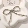Estilo coreano simple asimétrico lazo de perlas DIY tejido a mano clip para el pelo de cuentas accesorios para el cabello pendientes material al por mayor
