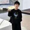 Camiseta de manga larga de algodón puro para niños, para primavera y otoño, camiseta básica de cuello redondo para niños, top de dibujos animados estiloso para niños mayores y pequeños