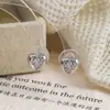 Pendientes Exquisitos y Compactos en Forma de Corazón con Circonita, Pinzas para Orejas Tipo Bobina de Mosquito para Mujer, Primavera y Verano, Lujo Ligero, Sensación de Alta Gama, Estilo Dulce y Fresco de Chica