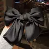 Clip de resorte con lazo de perla, accesorio para el cabello de alta gama, elegante y francés para celebridades de Internet.