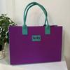Venta al por mayor de fábrica, nueva bolsa de fieltro con costura, bolso rojo de red, bolso de mano de fieltro con letras de gran capacidad, bolsa de regalo