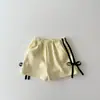 Conjunto de Roupa de Bebê para Meninas Verão 2026 Nova Moda Versátil Camiseta de Manga Curta com Babados com Conjunto de Shorts de Laço