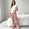 Conjunto de pijama de verano para mujer con camiseta de manga de mosca y pantalones largos, estampado de corazón de seda de leche, ropa para el hogar, transfronterizo europeo y americano