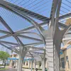Fabricante del Pabellón de Metal de Shanghái proporciona construcción a medida de pabellones con forma de arco de placa única de aluminio de doble curvatura para paisajismo de jardines