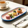 Juego de vajilla de cerámica de color bloque azul nórdico y rosa para uso doméstico, que incluye cuencos, platos, tazas, teteras, platos decorativos y moldes para hornear únicos, disponibles para exportación al por mayor.