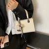 Bolso de mano casual para uso diario para mujer 2026 nuevo elegante de un solo hombro bandolera pequeño cuadrado estilo coreano ins temperamento"""