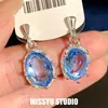 Pendientes de Botón Ovalados con Incrustaciones de Diamante y Aguja Plateada en Color Azul Marino Claro, con un Estilo Fresco y Minimalista, Pendientes de Diseño de Nicho para Mujer