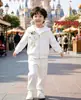 Nuevo traje de camisa blanca para niños verano algodón manga corta top 2025 nuevo traje de verano para bebé para niños