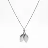 Nuevo collar de acero inoxidable de estilo europeo y americano transfronterizo que no se decolora, con modernos colgantes de corazón, hoja, cruz y cuentas