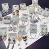 Pendientes elegantes de aro de metal estilo francés de alta calidad, estilo frío, ligeros, de lujo, a la moda, elegantes, combinables con todo, estilo europeo, con hebilla para la oreja.