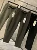 Alternativa asequible a los pantalones deportivos funcionales para exteriores, capa de aire de alta elasticidad, cintura con hebilla de otoño, pantalones casuales de punto de pierna recta