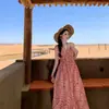 Vestido lencero a cuadros rojo sin mangas estilo francés para mujer, nuevo modelo de principios de verano 2026, elegante vestido largo para vacaciones en la playa
