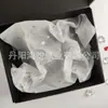Papel de cópia popular da Amazon 17g padrão de impressão papel pérola estilo ins papel de embrulho floral papel à prova de umidade atacado