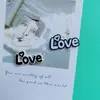 Novos adesivos LOVE tridimensionais letras de desenho animado grampo de cabelo buraco fivela de sapato copo capa de celular geladeira fivela de sapato