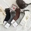 Novas meias de outono e inverno de altura média para mulheres, meias empilhadas de agulha dupla estilo japonês, meias longas decorativas de algodão respiráveis, atacado do fabricante