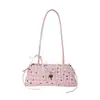 Bolsa de poá nicho para mulheres primavera e verão, novo modelo 2026, adequada para o trabalho, bolsa de ombro e de antebraço estilosa, bolsa de mão fashion, bolsa baguette