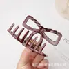 Pinza para el cabello nueva y mejorada con resorte, diseño de tapa de seguridad dorada, pinza de tiburón hueca con forma de lazo para mujer, venta al por mayor