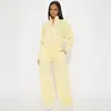 Conjunto de dos piezas para mujer: sudadera tipo polo con cremallera corta y cuello alto de manga larga estilo americano transfronterizo y pantalones deportivos casuales de pierna ancha con cintura alta y cordón