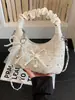 Bolso plisado de diseño único y nicho para mujer, nuevo bolso cruzado de moda 2026, bolso de mano pequeño súper popular, bolso de cuerno