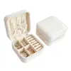 Popular en Europa y América, joyero compacto y portátil, caja de almacenamiento de accesorios de cuero, bolsa de almacenamiento antioxidante para pendientes, colgantes y anillos
