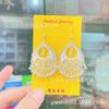 Pendientes de cabeza de vaca de pavo real bañados en plata de estilo étnico, pendientes de tambor de fénix, pendientes de mujer artesanales cepillados especiales, gotas para los oídos