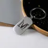 Venta Caliente de Productos Nuevos Transfronterizos 26 Letras Inglesas Huecas de Acero de Titanio Sin Decoloración Accesorios de Joyería Llavero 26 Letras