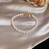 Pulseira de Pérolas Redonda Francesa Extensível Moda Design Simples Senso de Design Nicho Pulseira Diária Versátil Toque de Luxo Joia de Mão