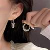 Aretes de anillo de diamantes de alta gama de lujo ligero nicho aretes exagerados aretes grandes mujeres viento frío joyería de moda al por mayor