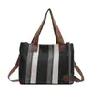 Bolsa de lona transfronteiriça para mulheres, novo modelo 2026, bolsa tote grande para o dia a dia, bolsa de ombro transversal casual, bolsa de mão