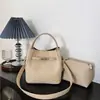 Bolso Cubo Tejido Simple de Gama Alta para Mujer 2026 Nuevo Bolso de Mano Bolso de Hombro Versátil con Nicho Bolso Tote Elegante