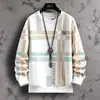 Camiseta masculina xadrez color block da moda, nova coleção outono/inverno 2026, modelagem solta, afina a silhueta, blusa casual de manga longa, segunda pele masculina
